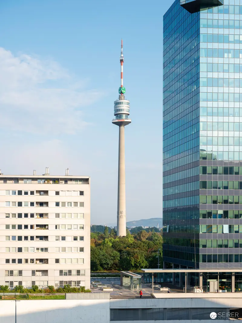 Vienna's Donauturm Television Tower Amid Modern Urban Architecture