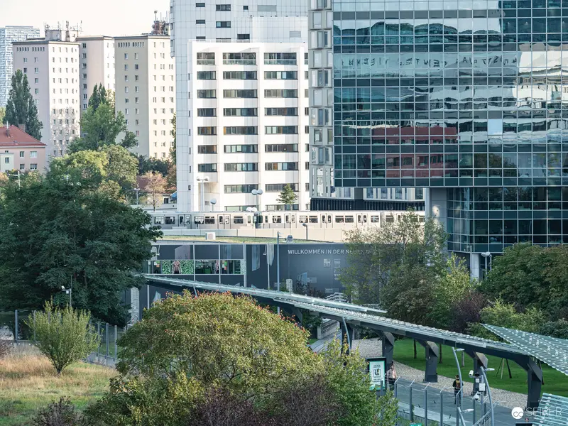 Modern Urban Landscape with Elevated Train at Vienna International Center
