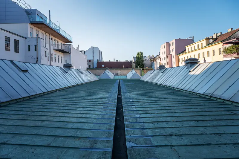 Urban Architectural Perspective: Symmetrical Roofline Between City Buildings