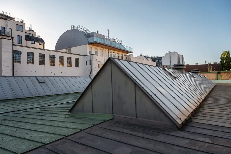 Urban Architectural Roofscape with Geometric Metal and Zinc Roof Structures