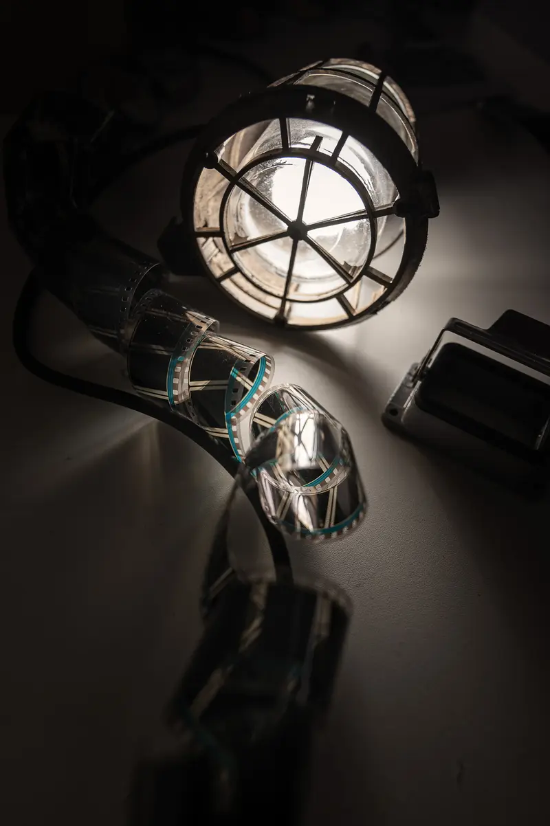 Industrial Cage Light and Safety Protective Gear in Dramatic Monochrome