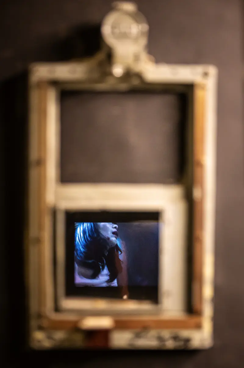 Framed Perspective: Artistic Reflection Through Vintage Wooden Window