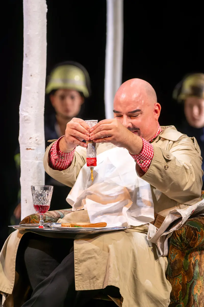 Actor in Beige Coat Performing in "Biedermann und die Brandstifter" at Theater der Josefstadt