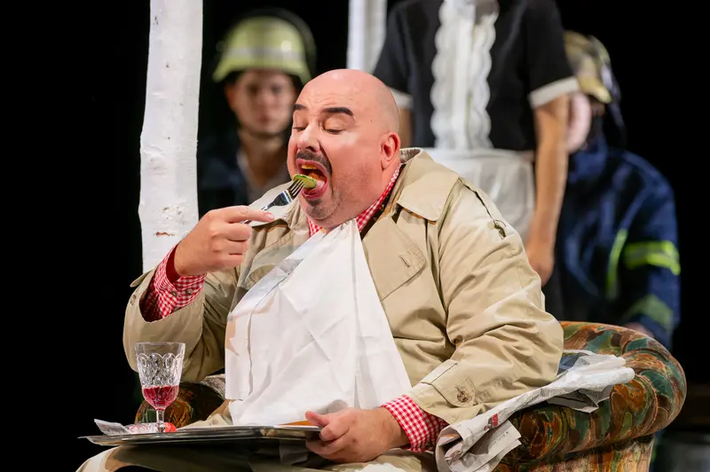 Actor Eating Lunch in Theater der Josefstadt Production of "Biedermann und die Brandstifter"