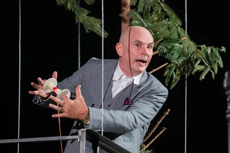 Actor in Gray Suit Performing in "Biedermann und die Brandstifter" at Theater der Josefstadt