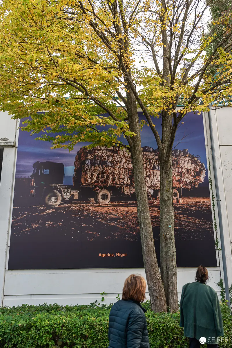 Agricultural Machinery Photo Displayed at Outdoor Exhibition with Tree Framing