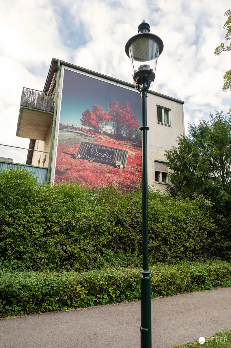 Urban Street Lamp and Billboard with Vintage Vehicle in Pink Landscape