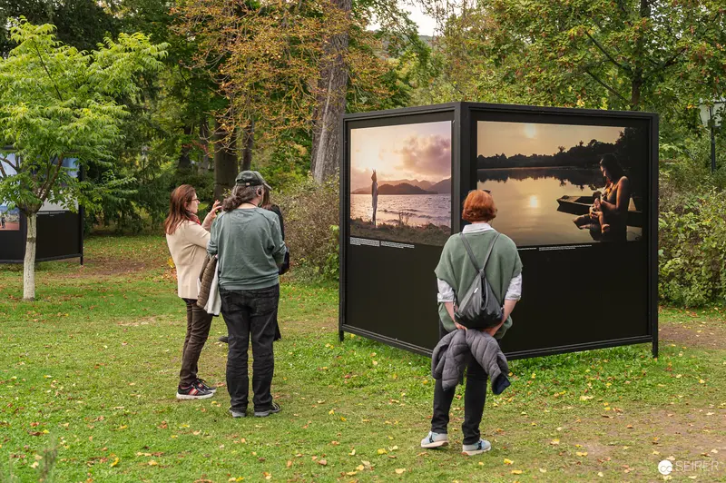 La Gacilly Baden Photo Exhibition: Visitors Viewing Landscape Prints Outdoors