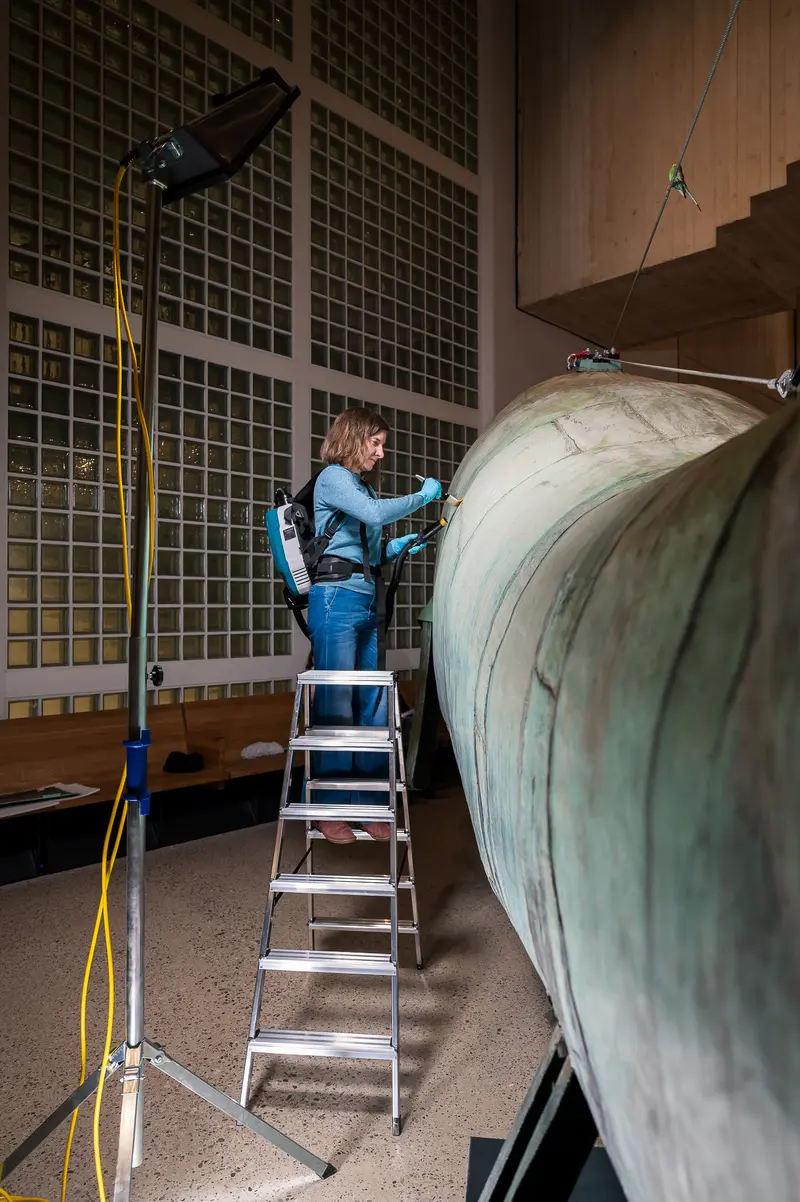 Conservator Restoring 'Poldi' Whale Sculpture at Wien Museum's Days of Restoration 2024