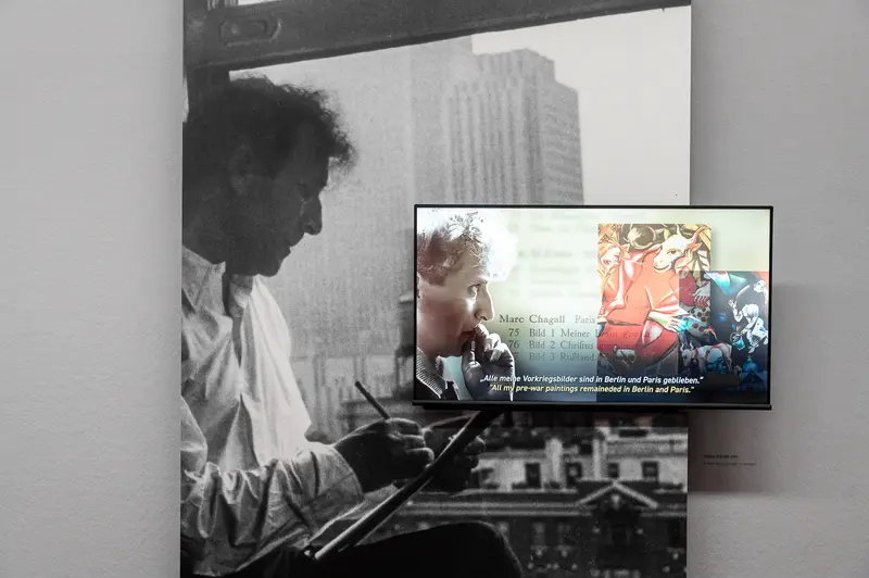 Marc Chagall Exhibition at Albertina Museum: Artist Silhouetted Against Urban Backdrop