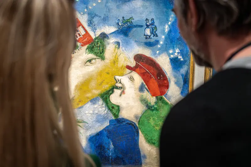 Visitors Viewing Marc Chagall Artwork at Albertina Museum Exhibition in Vienna