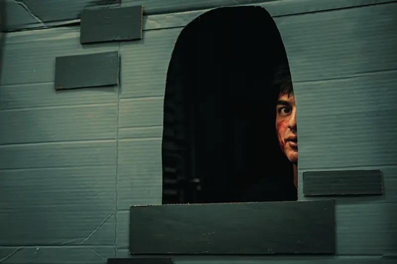 Haunting Figure Emerging from Shadowy Architectural Void at Webster University