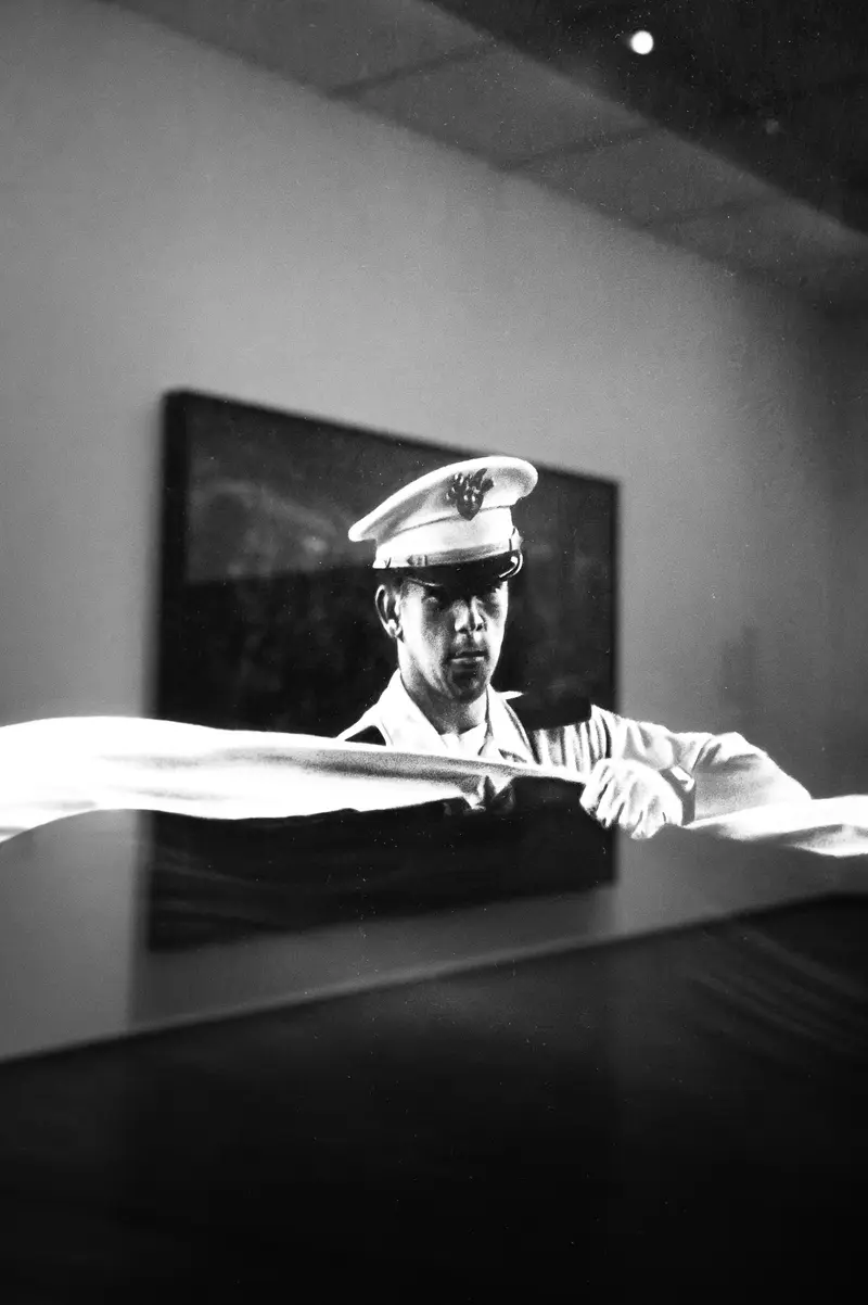 Military Officer in Monochrome Portrait at Gallery Exhibition