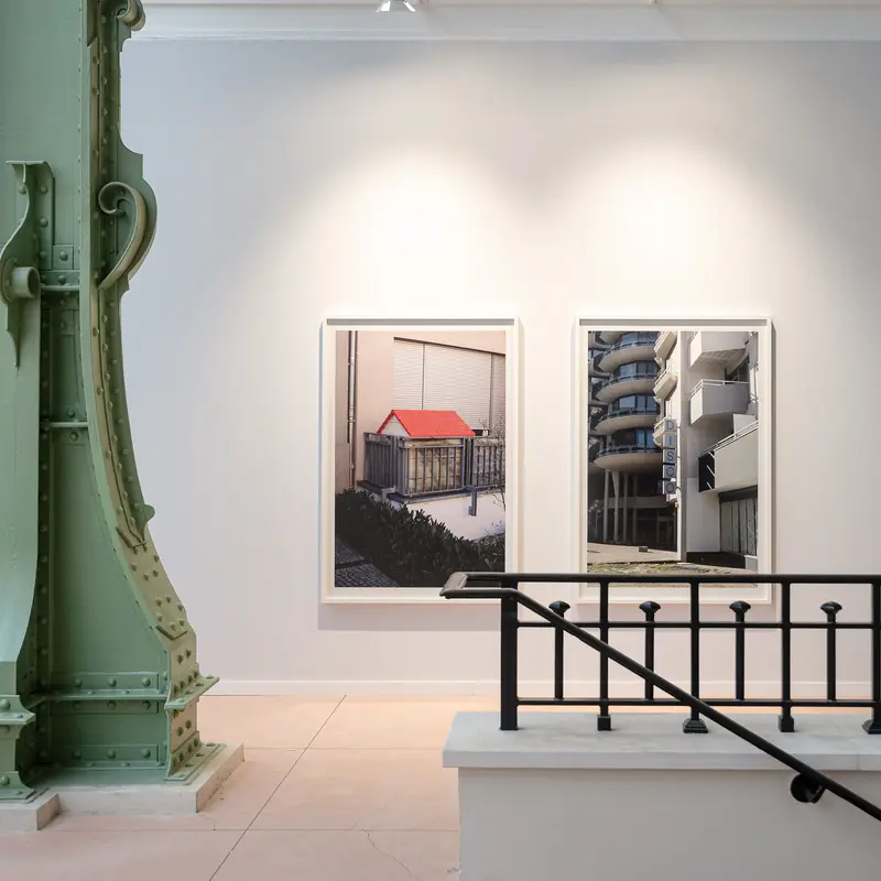 Paris Photo 2024 Exhibition View with Architectural Photographic Prints and Green Structure