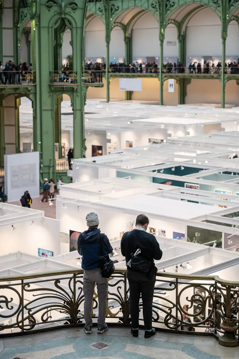 Visitors Overlook Paris Photo 2024 Art Fair at Grand Palais