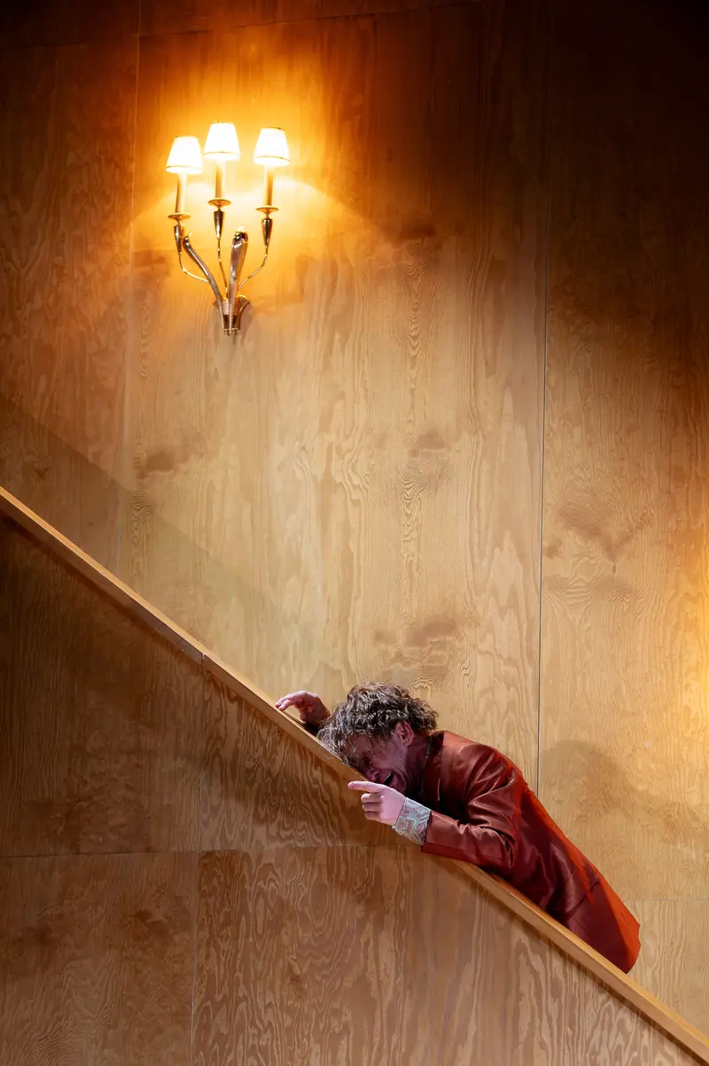 Raphael von Bargen as Uncle Wanja Climbing Stairs in Theater Performance