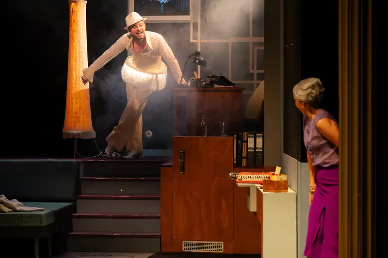 Two Actors in Dramatic Scene from "Miss Scrooge" Theater Production
