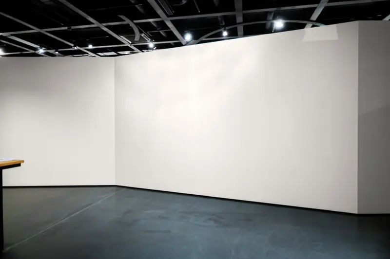 Empty White Gallery Space with Spotlit Walls and Exhibition Lighting