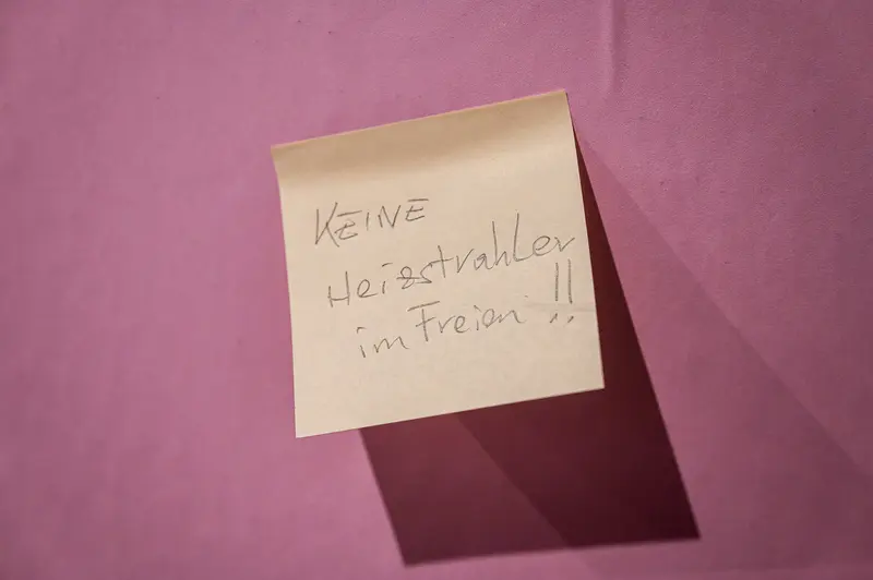Handwritten Note on Pink Background Stating "No Art Dealers in the Wild"