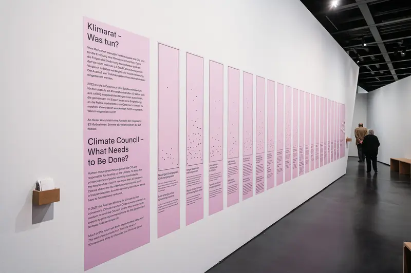 Climate Council Exhibition: Pink Informational Panels on Climate Action Strategies
