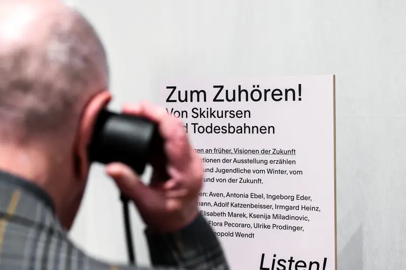 Visitor Listening at "Winter in Vienna" Exhibition Opening at Wien Museum