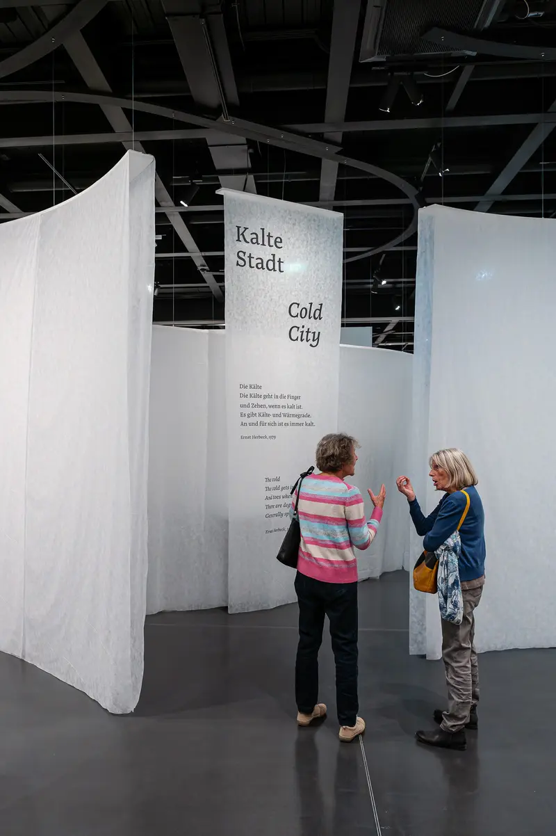Visitors Exploring "Cold City" Exhibition at Cultural Venue