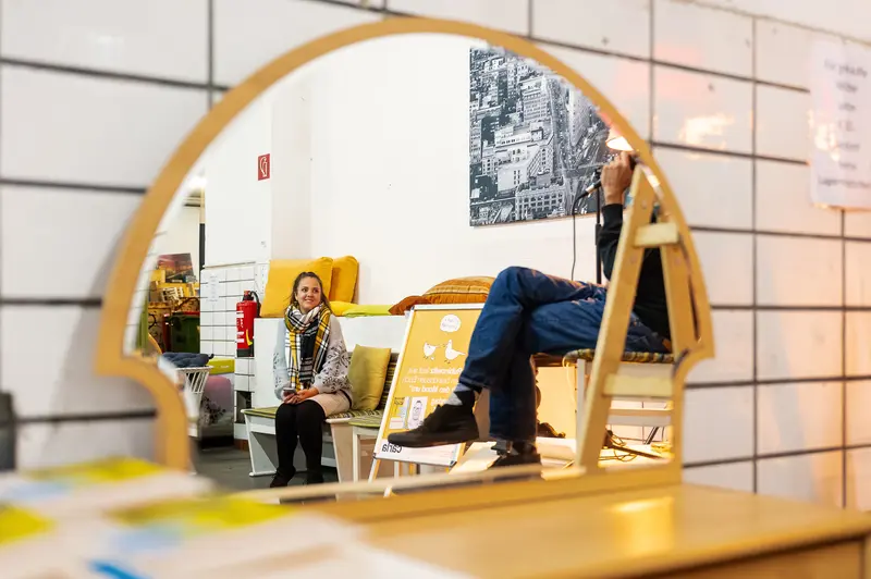 Interior View of Workspace with Yellow Chairs and Urban Photography