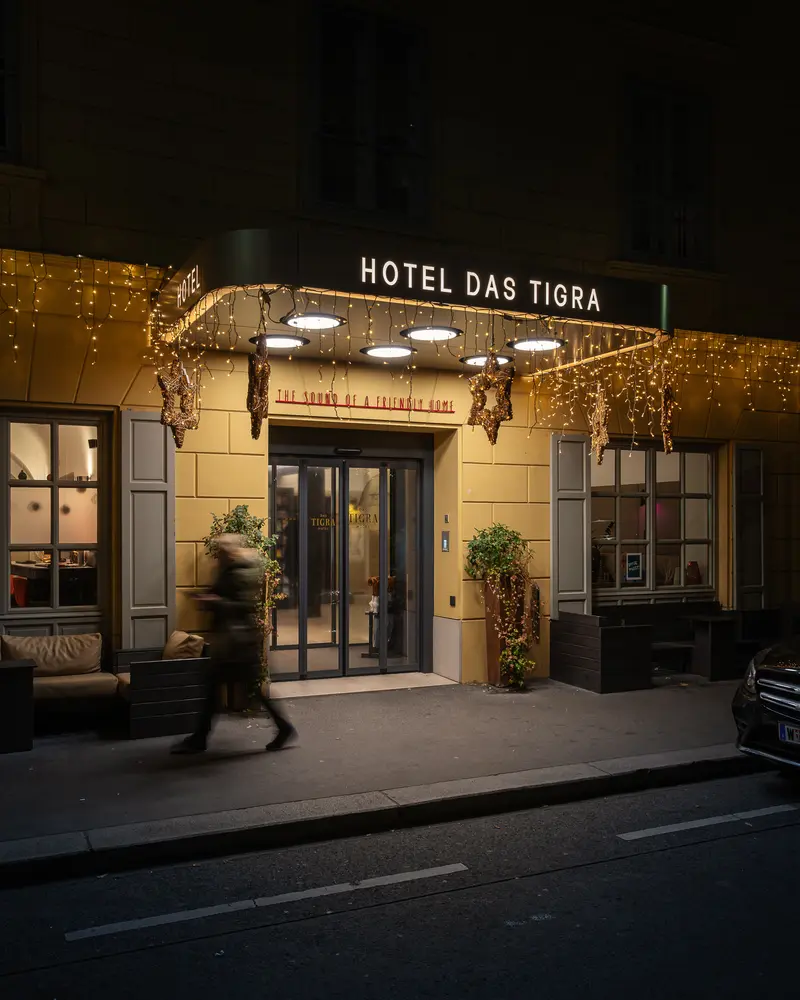 Hotel Das Tigra Entrance at Night with Festive Golden Lighting