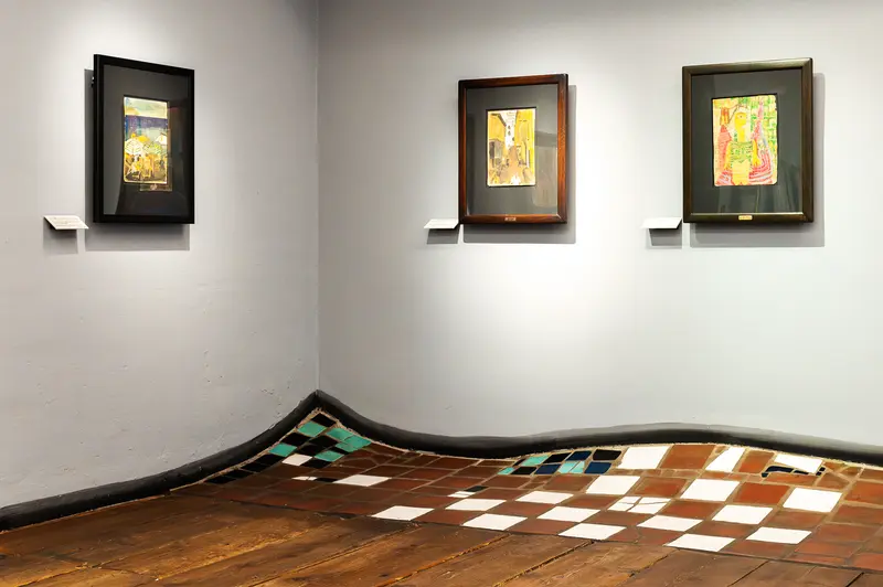 Gallery Corner Display: Three Framed Artworks with Geometric Floor Installation
