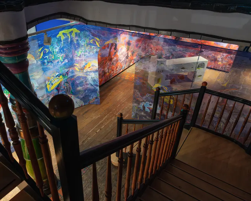 Curved Art Gallery Interior with Vibrant Abstract Paintings on Wooden Staircase