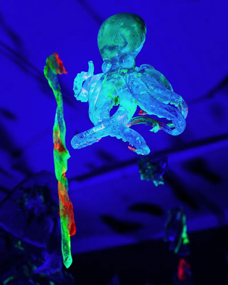 Fluorescent Skeletal Figure Suspended in Blue Ultraviolet Light
