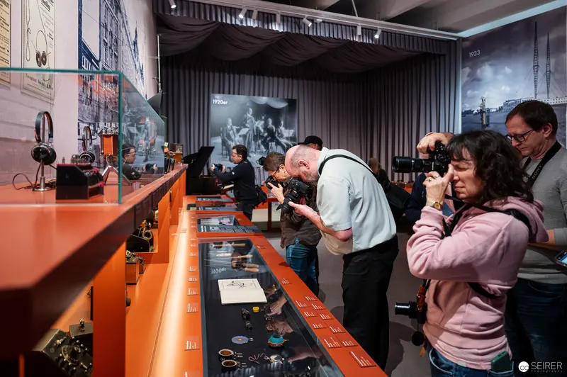 Visitors Exploring Radio Technology Exhibition at Technical Museum Vienna