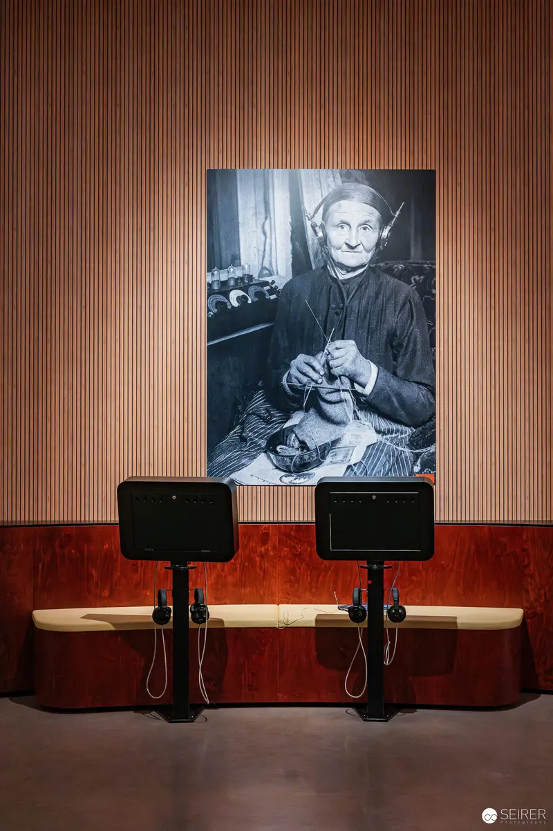 Vintage Portrait of Elderly Woman Knitting at Exhibition "100 Years of Radio"