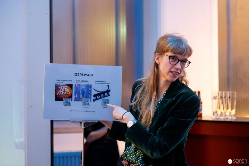 Presenter Pointing at Exhibition Display for "100 Jahre Radio" at Technical Museum Vienna