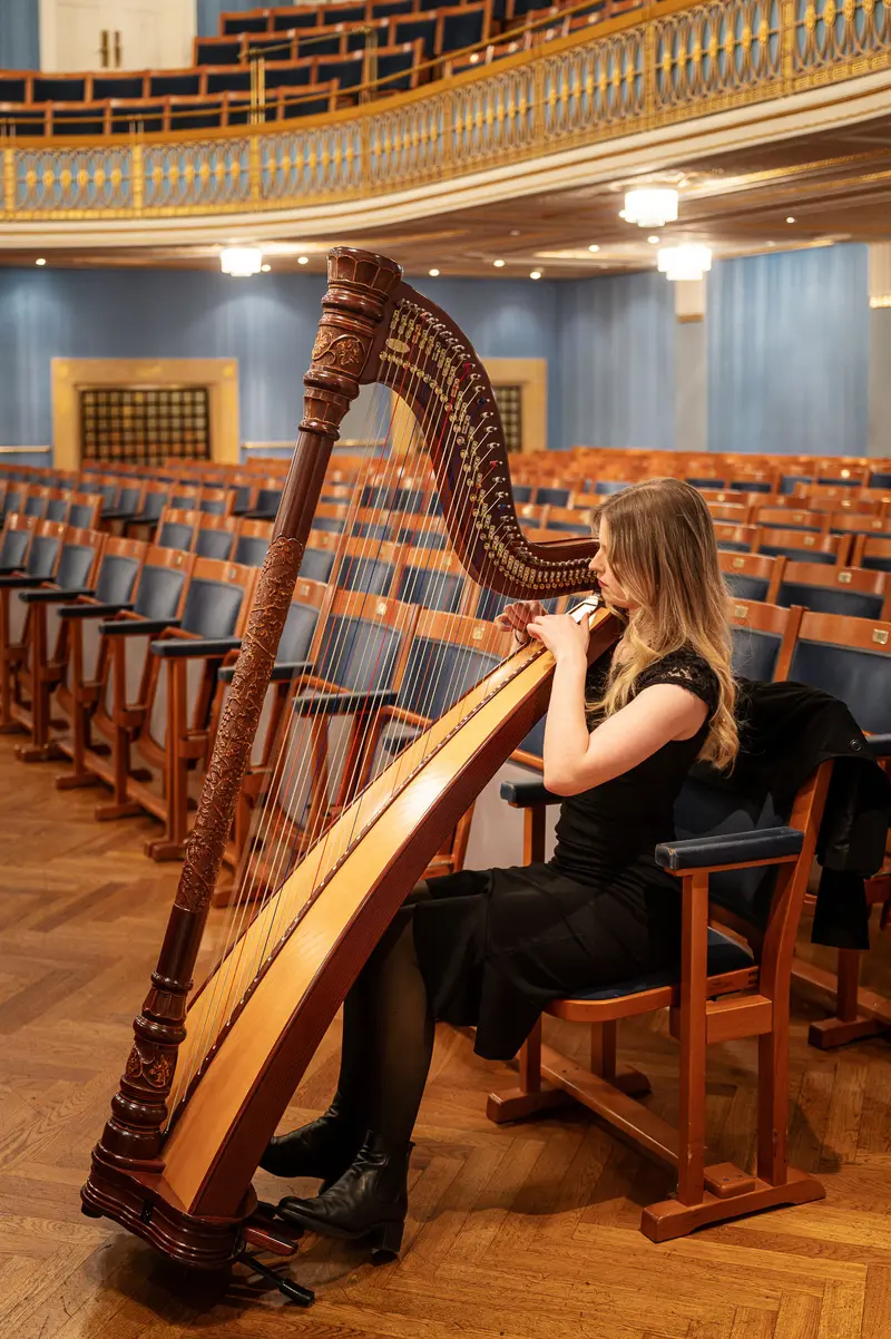 Harpist Performing Solo at TU Orchestra Concert in Konzerthaus Wien