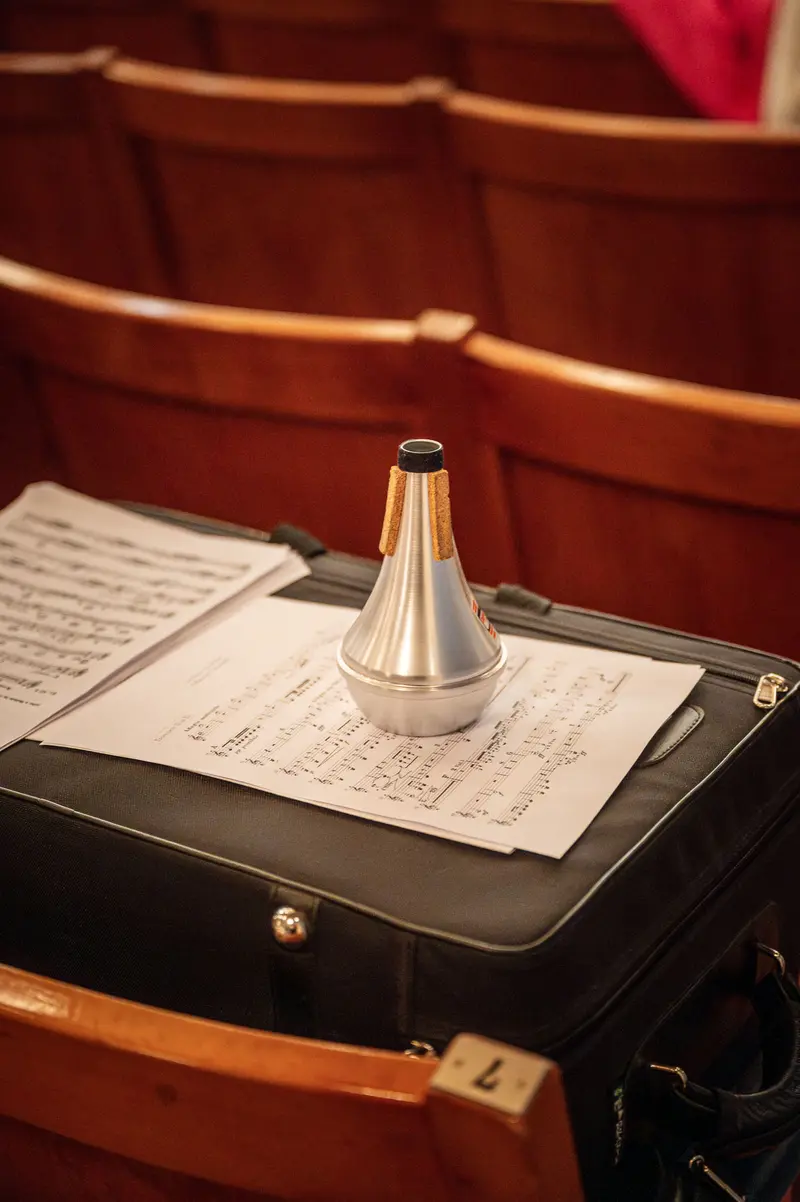 Brass Mute on Sheet Music at Orchestra Performance Venue