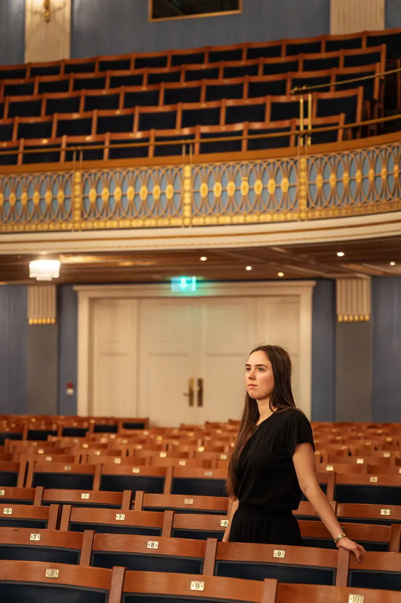 Solitary Figure in Empty Konzerthaus Wien Auditorium