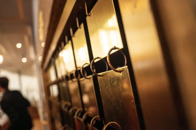 Metallic Rings Hanging on Vintage Brass Display Rack