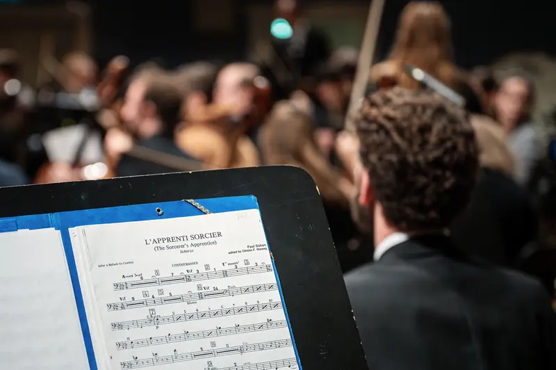 L'Apprenti Sorcier Sheet Music at Orchestra Performance in Concert Hall