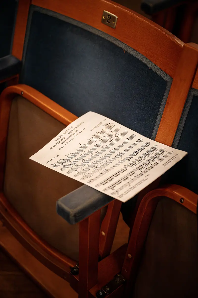Musical Score on Wooden Concert Hall Seat at TU Orchestra Event