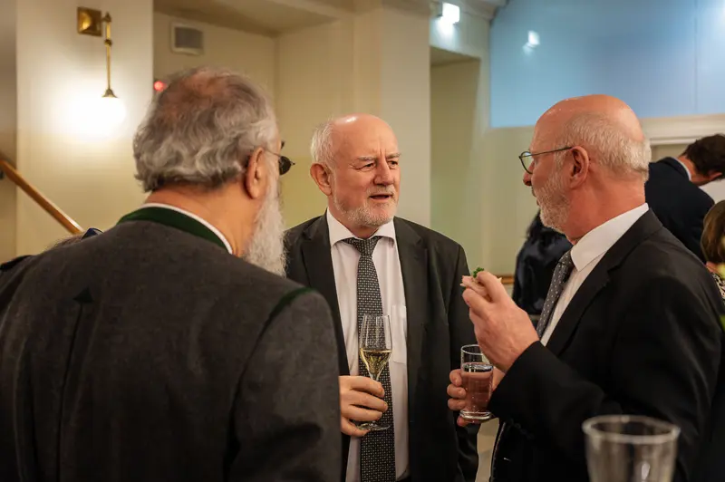 TU Orchestra Members Conversing During 40th Anniversary Celebration Event