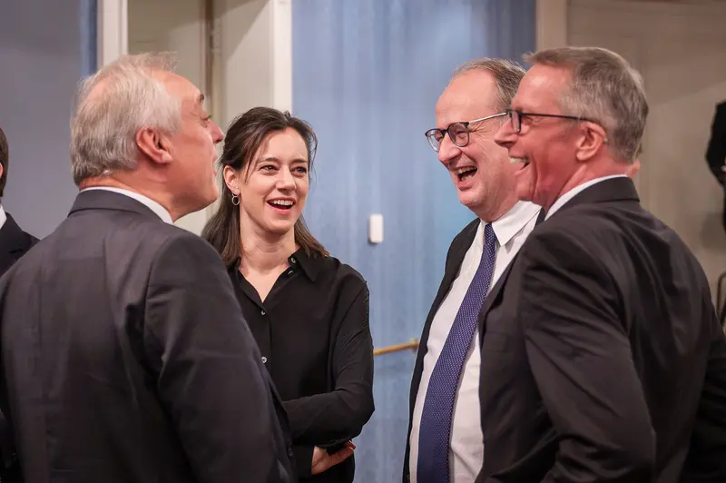 TU Orchestra Members Laughing Together at 40th Anniversary Event in Konzerthaus Wien