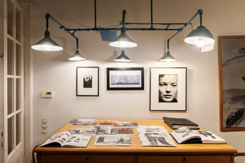 Elfie Semotan's Atelier: Photographic Workspace with Vintage Lights and Archival Images