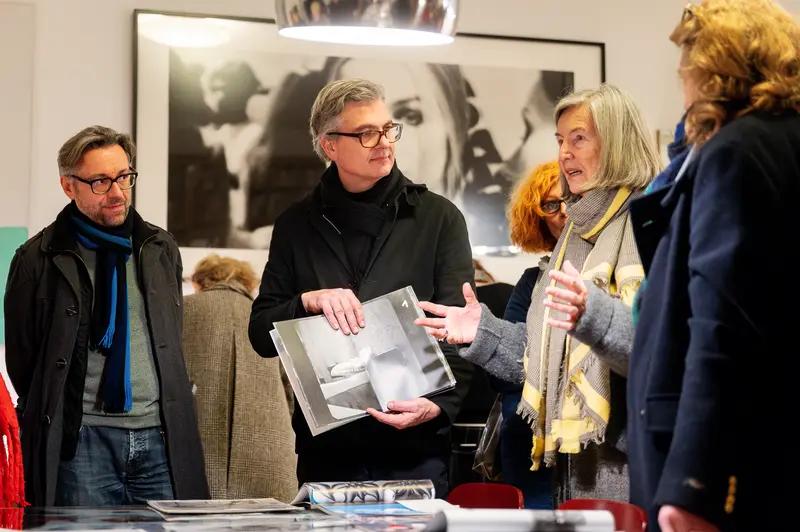 Elfie Semotan's Atelier: Visitors Examining Photographic Works During "In Transition" Event