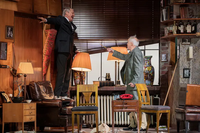 Actors on Chairs in Intense Theatrical Staging of "Sonny Boys"