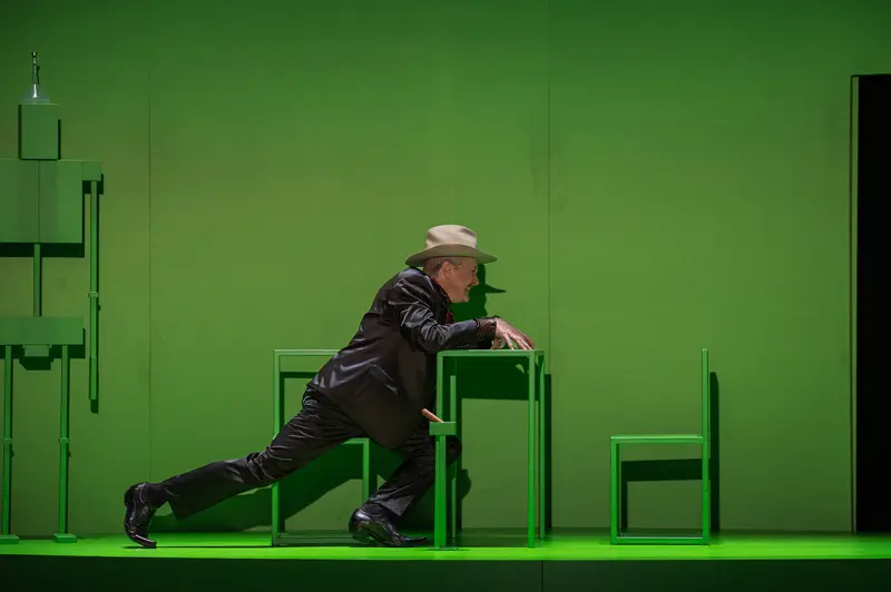 Actor in Green Stage Setting Performing Theatrical Movement during "Sonny Boys" Rehearsal