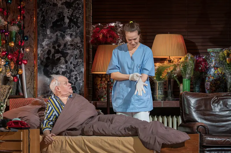 Nurse Attending to Elderly Patient in Domestic Care Setting