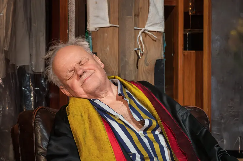 Exhausted Performer Resting During "Sonny Boys" Theater Rehearsal in Josefstadt