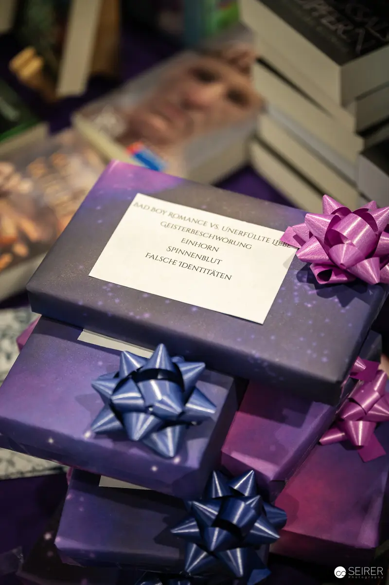 Purple and Blue Gift Boxes with Decorative Bows and Greeting Card