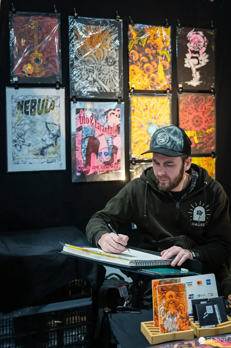 Artist Creating Graphic Posters at Design Studio Workspace